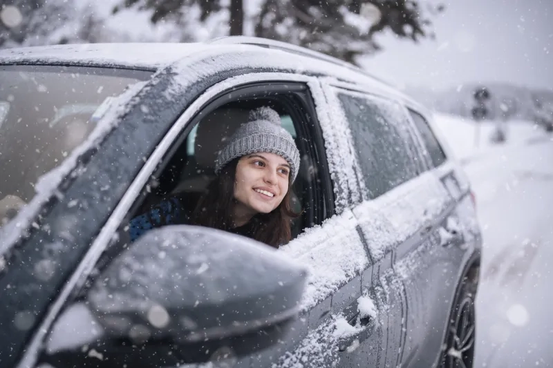 woman in car in the winter