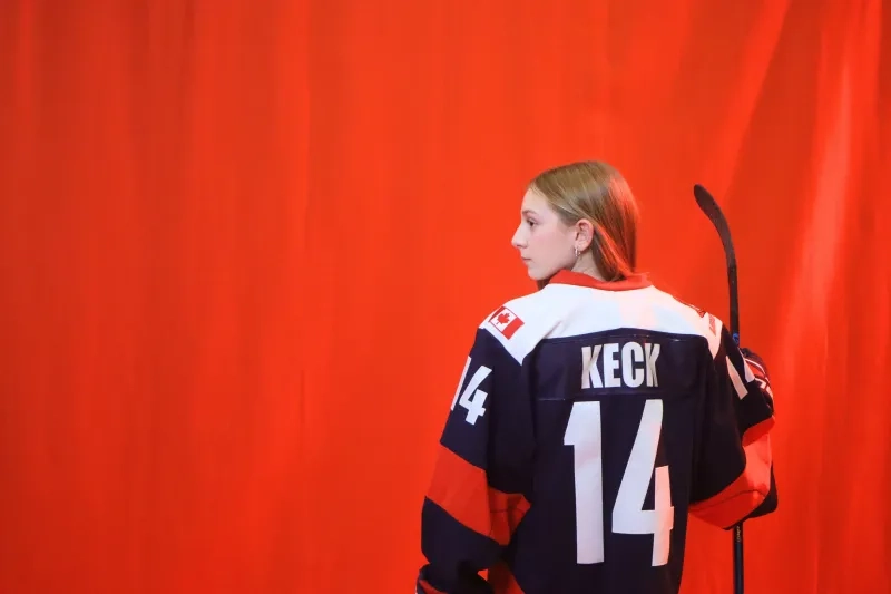 A young teen girl poses with her back to the camera in a promo video for 2026 Sens Skills junior draft video