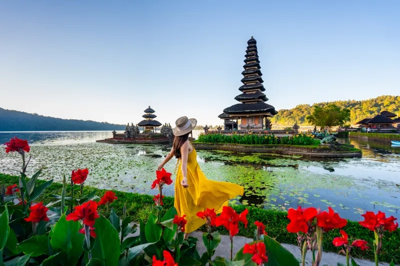 tourist relaxing and enjoying the beautiful view at Ulun Danu Beratan temple in Bali, Indonesia
