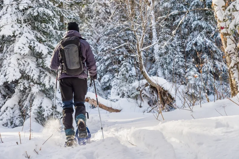 man snowshoeing