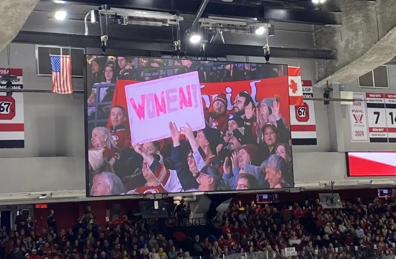 Fans holding sign at Ottawa Charge game