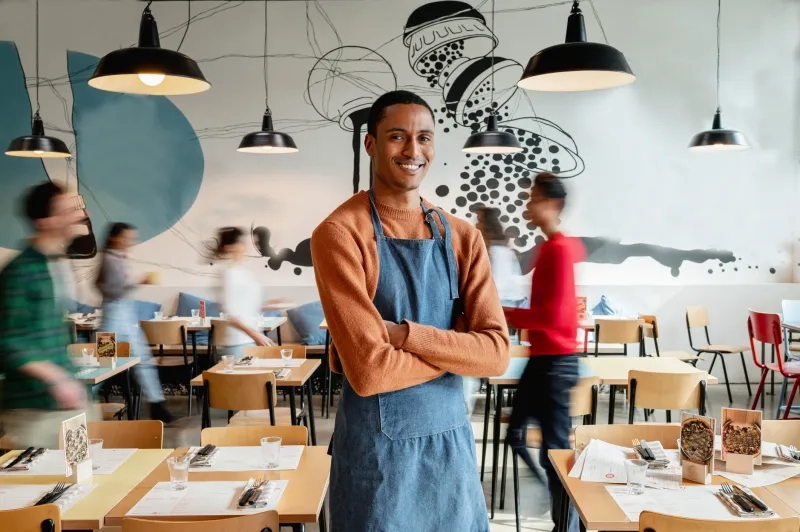 smiling cafe owner