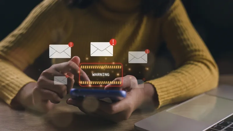 Businesswomen using laptops show warning signs after getting attack phishing emails 