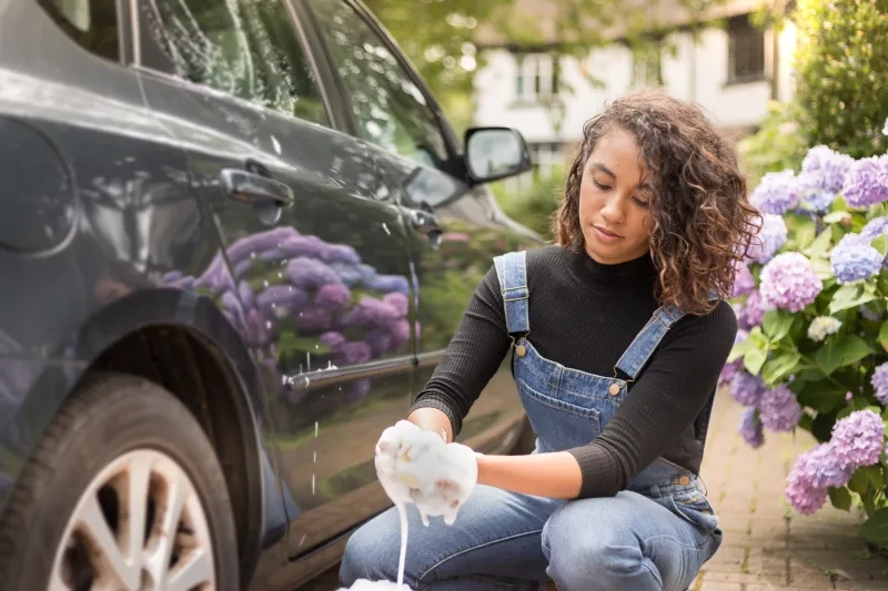 woman washing her car