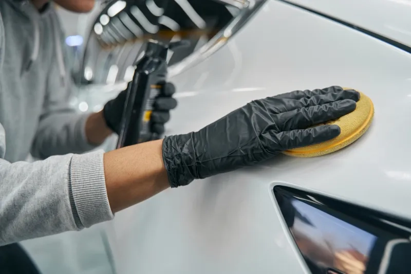gloves waxing exterior of car