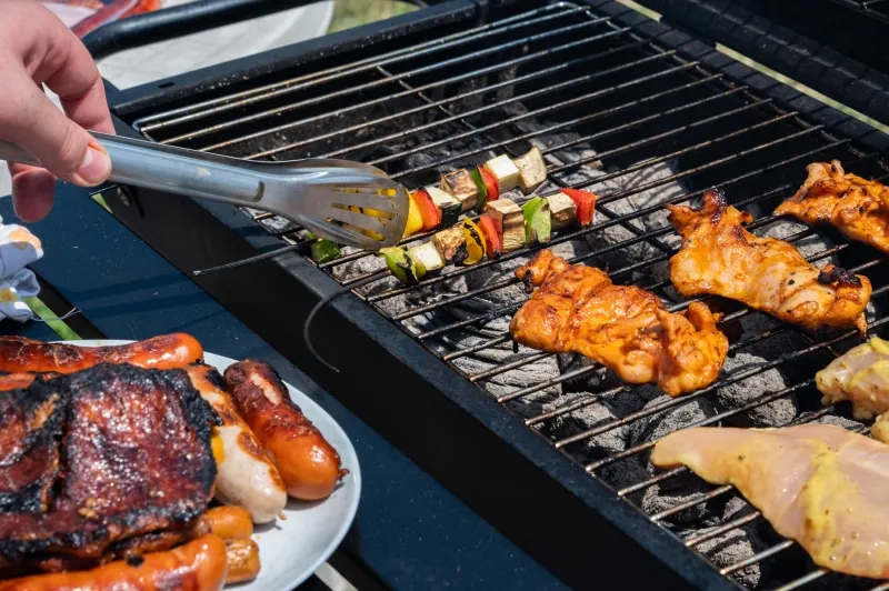 Grilled chicken and vegetable skewers on barbecue 
