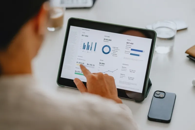 reviewing financial data on tablet 