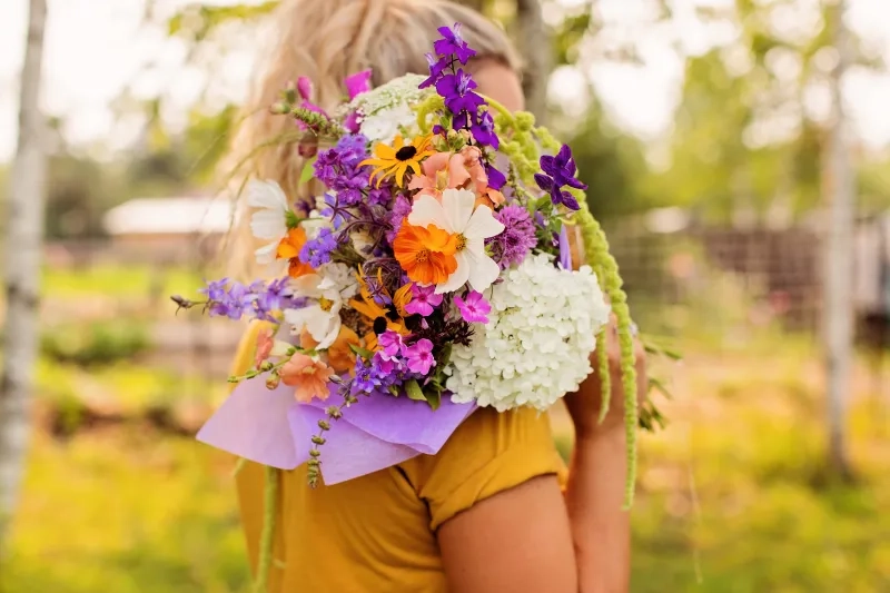 holding flowers from Wildling Acres 