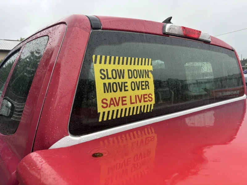 Slow down move over sign in truck