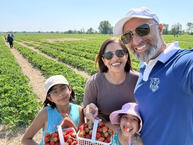 CAA Member berry picking with family