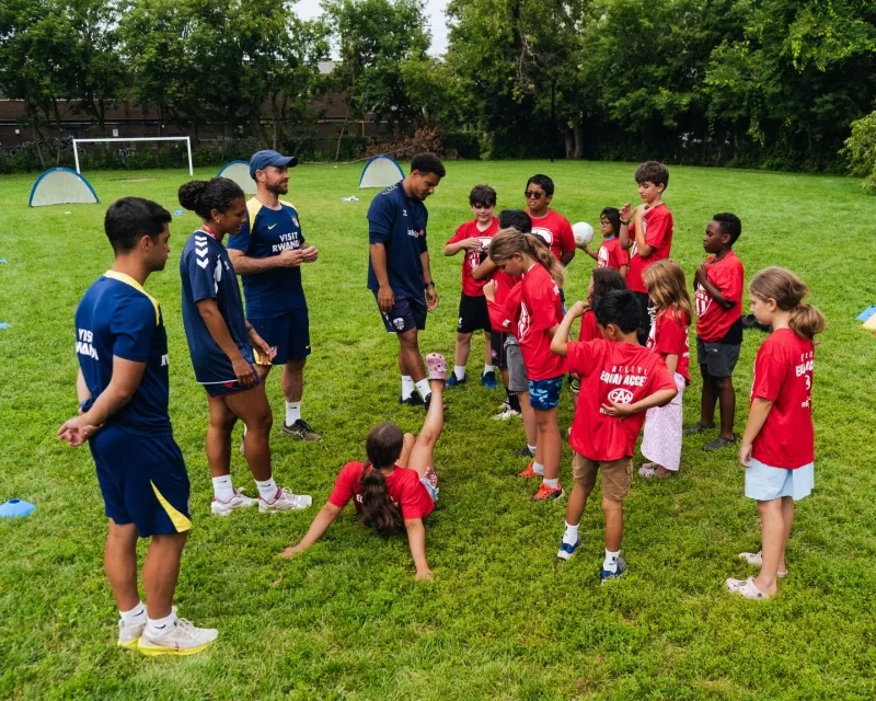 Atletico Madrid youth coaches speaking to young soccer players