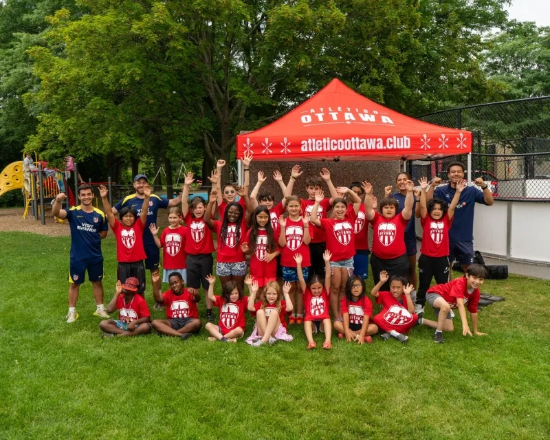Cheering kids at soccer camp