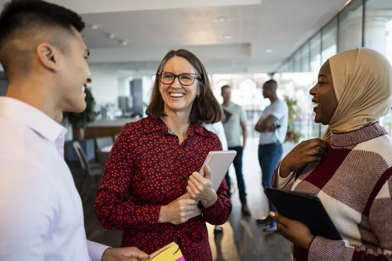 group of business professionals talking at a meeting