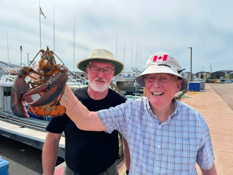 Man holding a lobster