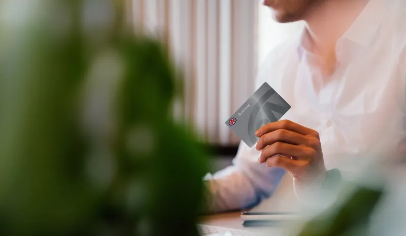Person holding CAA Membership card