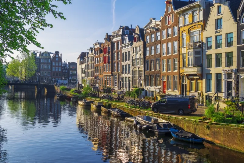 Amsterdam Downtown with Canal Houses and Boats on the Canal
