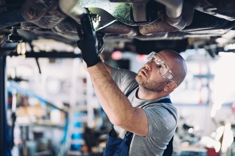 Mechanic working in auto repair shop