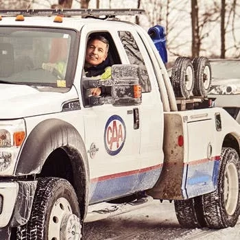 CAA tow truck with smiling driver