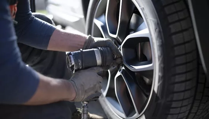 Changing tire on vehicle