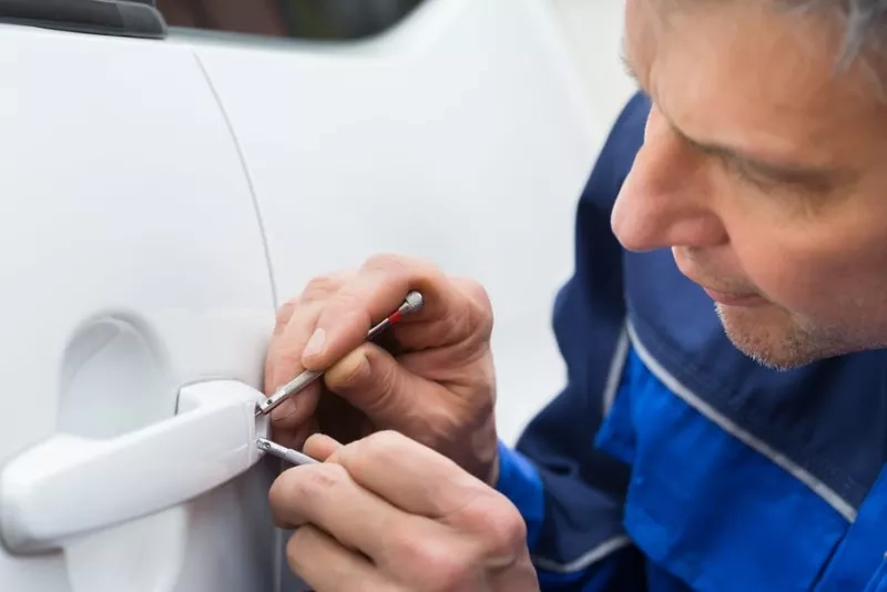 man picking the lock. lock-out service 