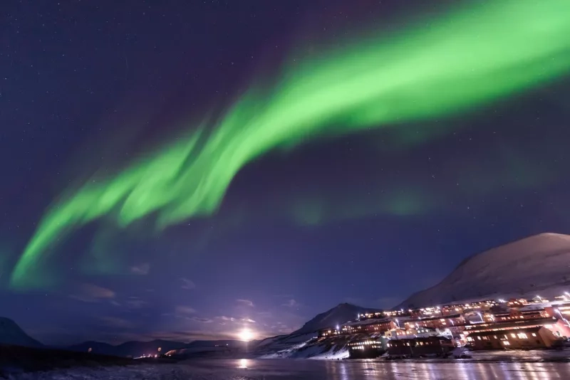 polar arctic Northern lights aurora borealis sky star in Norway Svalbard in Longyearbyen city  mountains