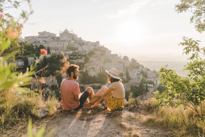 Woman and man looking at scenic view  of Gordes village in Provence