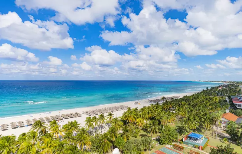 Top view of resort town of Varadero. Cuba. Long beach is 20 km away with sun loungers and thatched umbrellas and lots of palm trees.