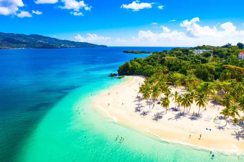 Aerial drone view of beautiful caribbean tropical island Cayo Levantado beach with palms. Bacardi Island, Dominican Republic. Vacation background.