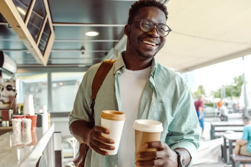 student picking up a coffee