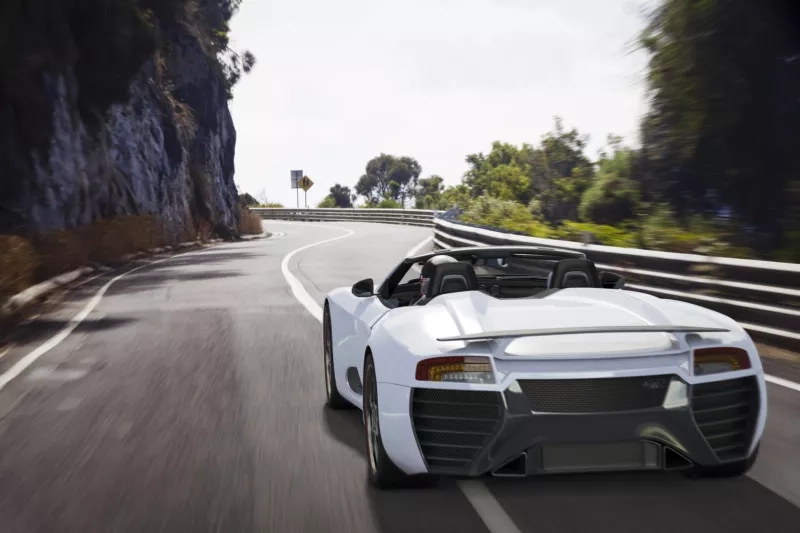 Sports Car on a Coastal Road