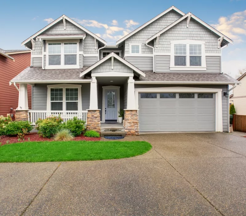 Large modern home with gray exterior.