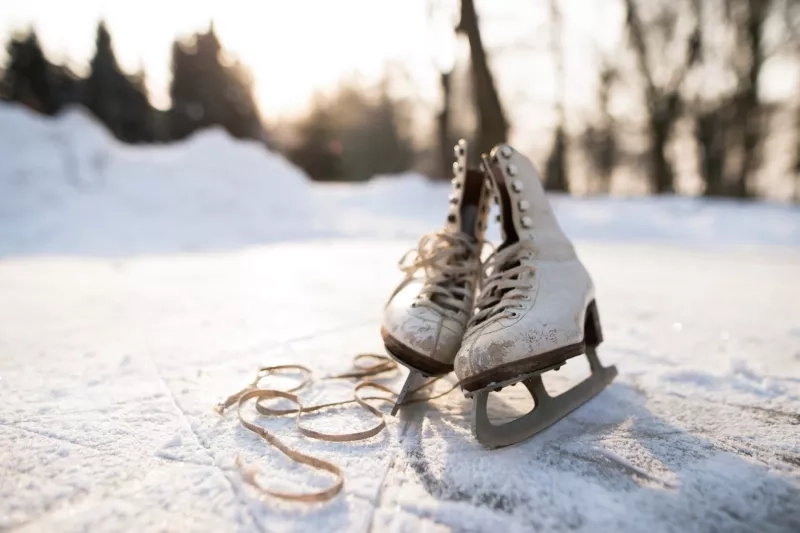 Old womans ice skates on the ice.