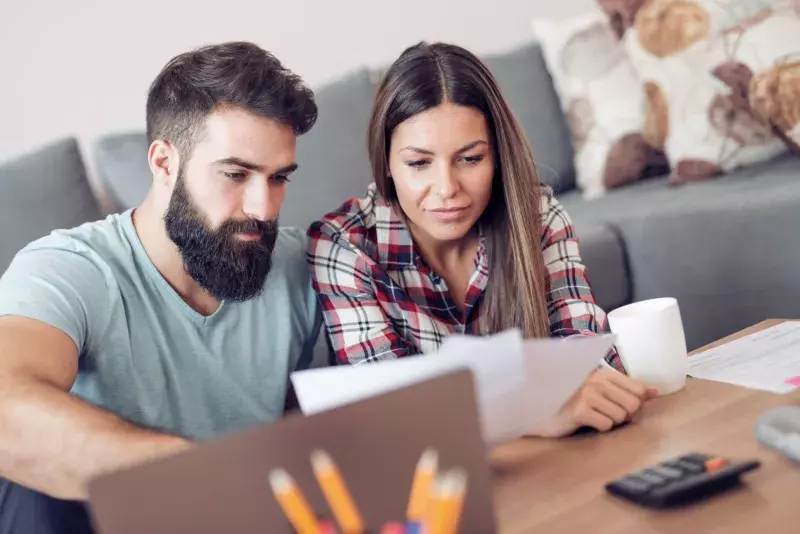 couple looking at papers